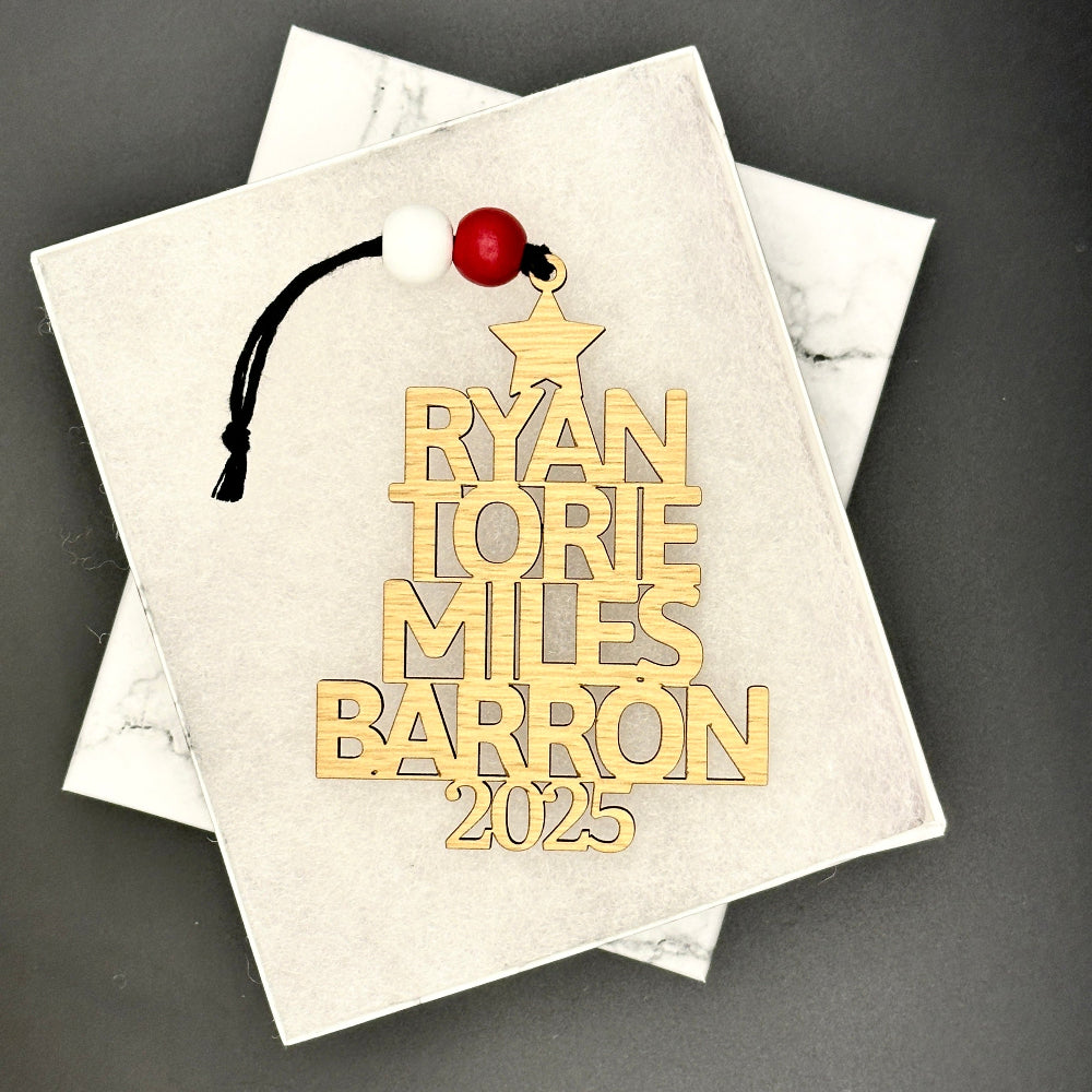 Custom engraved family name holiday ornament with decorative gift box packaging