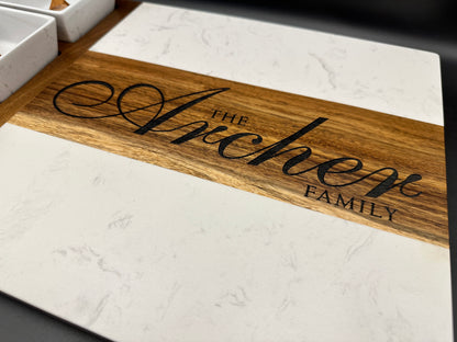 Marble and Acacia wooden cutting board with engraved 'The Arichene Family' on wooden surface