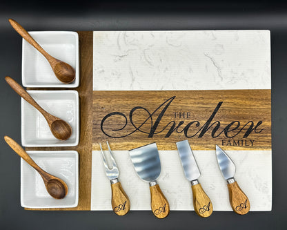 Personalized marble and acacia charcuterie board engraved with family name